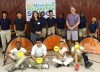 Rougon Elementary students, PC Electric Employee, Jill Copeland and Rougon Coach Steven Sellers poses with students from Rougon and donated equipment.